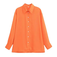 Kräftige orange Bluse mit langen Ärmeln