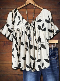 Tryne | Airy blouse with botanical print and V-neck