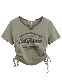 Top crop retro con letras Zenith
